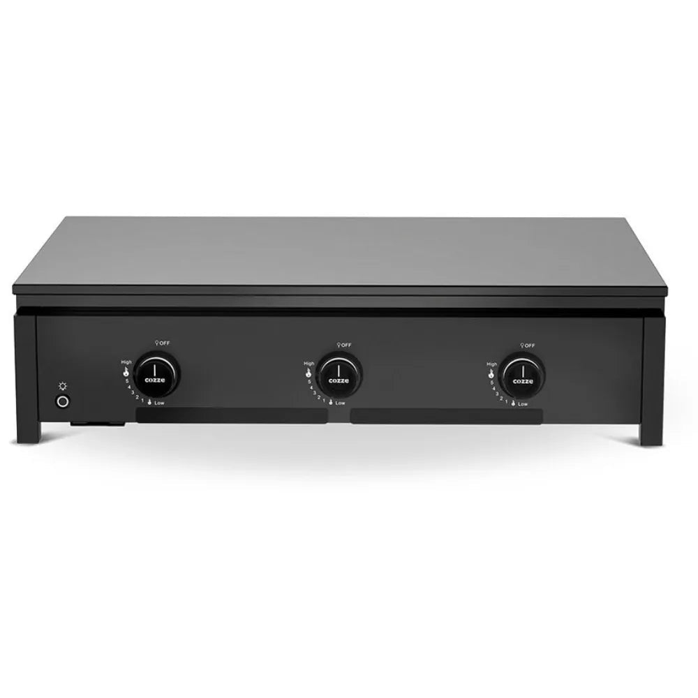 Black rectangular Cozze smash and sear grill with three circular control knobs and indicator light on countertop grill