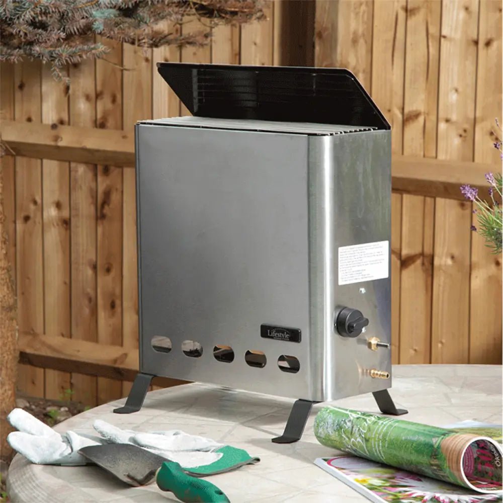 Stainless steel Eden Pro 4.2kW greenhouse heater with black lid and adjustable control knob for outdoor use
