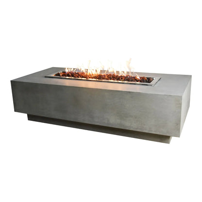 Elementi Granville fire table with 13.2 kW rectangular stainless steel fire pit insert and glowing lava rocks on gray concrete