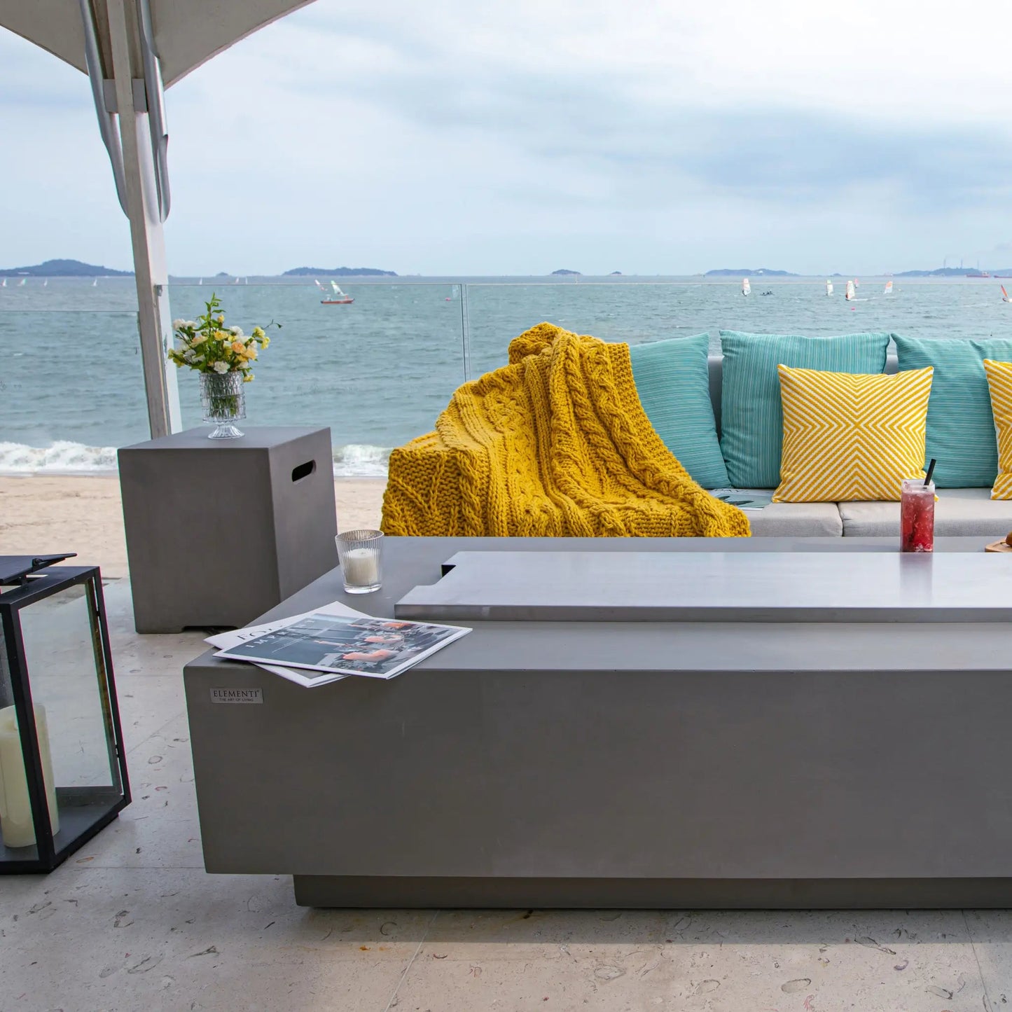 Gray modern outdoor coffee table with sleek minimalist design and smooth surface in Elementi Granville Fire Table 13.2 kW