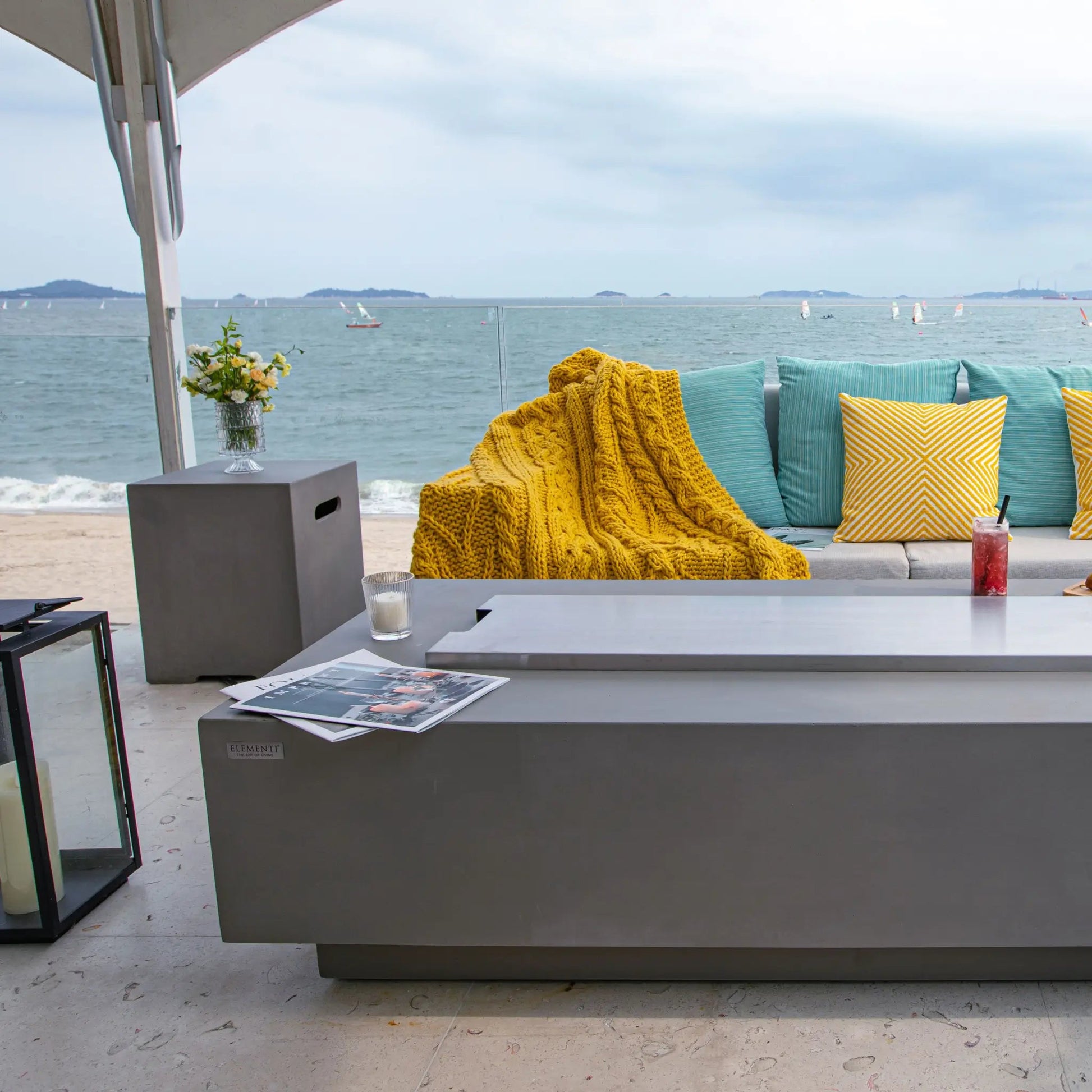 Gray modern outdoor coffee table with sleek minimalist design and smooth surface in Elementi Granville Fire Table 13.2 kW