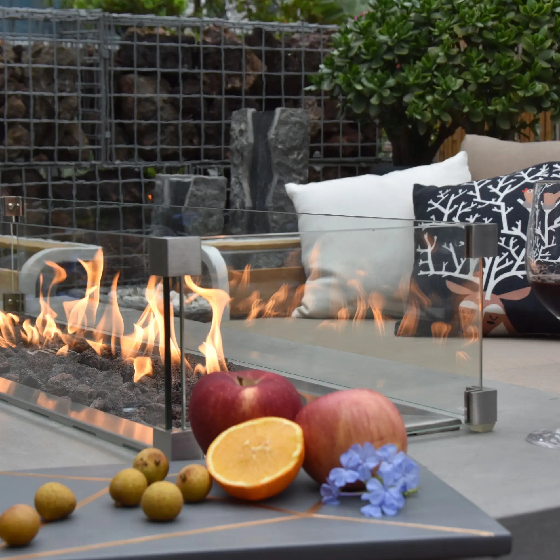 Elementi Granville fire table with modern glass enclosure stainless steel accents and flickering orange flames