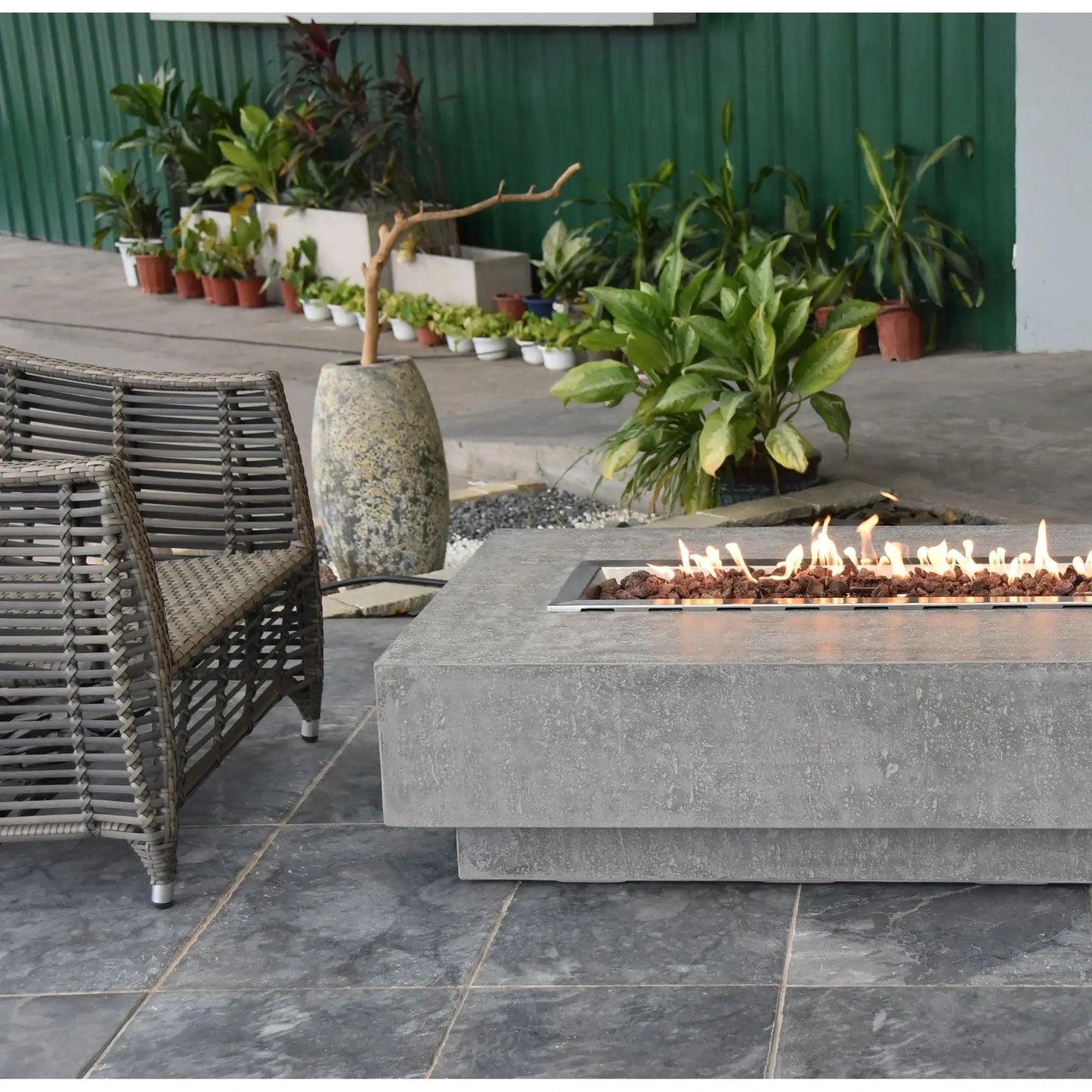 Gray concrete fire pit elementi hampton fire table with rectangular metal insert and burning flames 13.2 kW