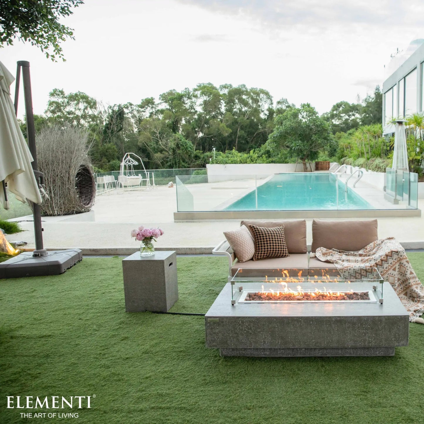 Elementi Hampton fire table modern concrete rectangular fire pit with sleek design and visible flames inside