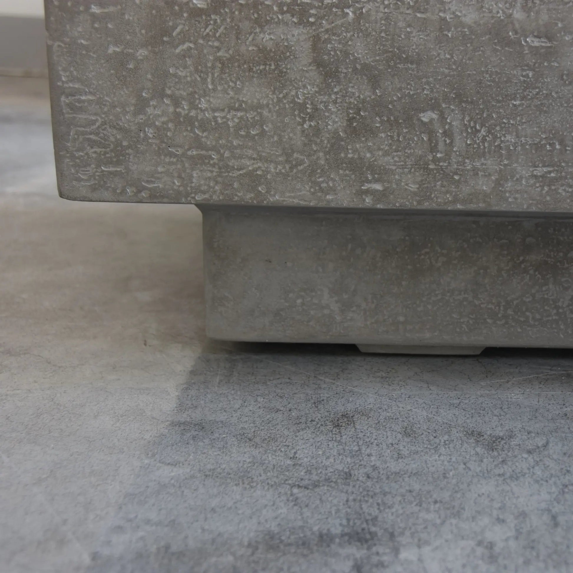 Gray concrete planter with textured speckled surface and rectangular base for elementi kingsale fire table 13.2 kw