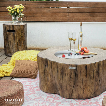 Rustic wooden coffee table with a circular metal top and natural wood grain finish from elementi manchester fire table 13.2 kW