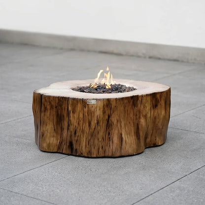 Elementi manchester fire table 13.2 kw rustic natural wood fire pit resembling tree stump with visible grain and bark texture