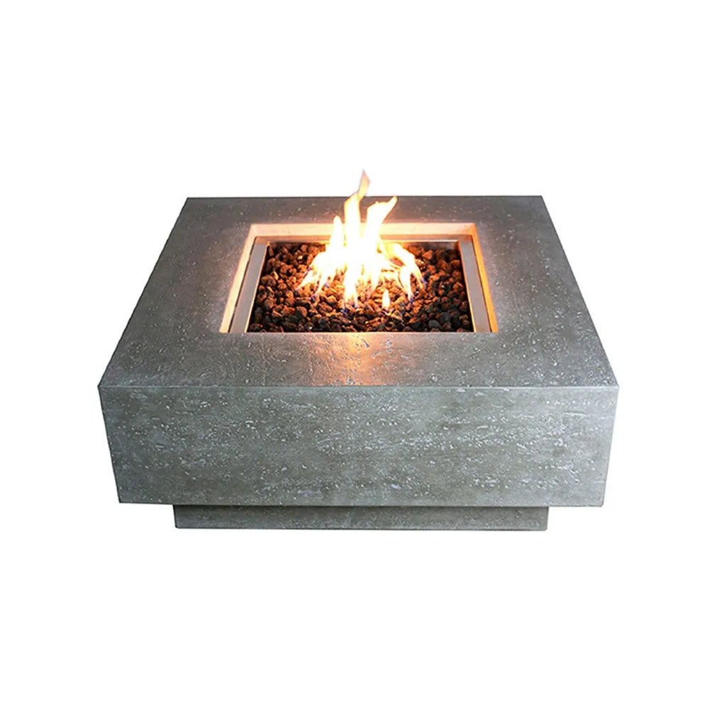 Modern gray stone Elementi Manhattan gas fire table with square design and glowing flame inside for outdoor use