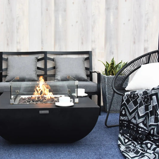Black modern Elementi Modeno Aurora fire pit table with glass enclosure and burning flame 14.7 kW OFG114
