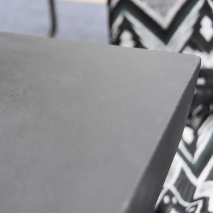 A sleek matte gray rectangular corner of the Elementi Modeno Aurora fire table with a smooth modern finish