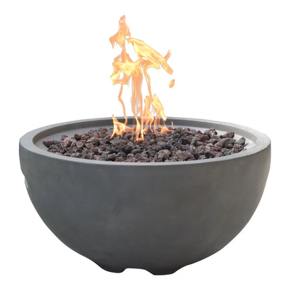 Dark gray concrete Elementi Modeno Nantucket fire bowl with flickering orange flames over black lava rocks