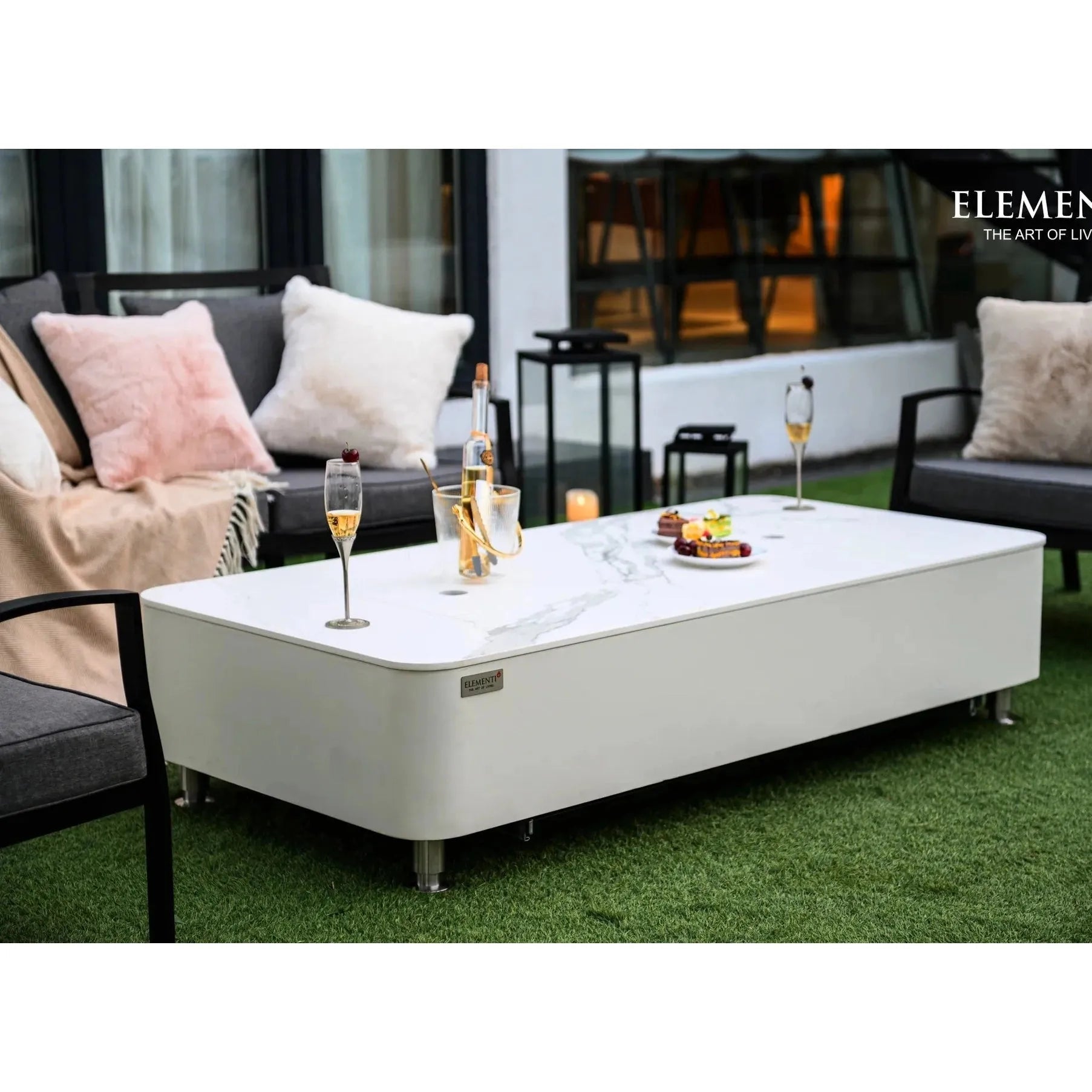 White rectangular coffee table with marble-patterned top and sleek metallic legs elementi plus athens fire table 16 kw