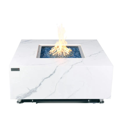 Elementi Plus Bianco fire table in white marble effect with central flame and blue glass beads for outdoor use
