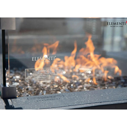 Elementi Plus Cannes fire table with modern glass enclosure metallic frame and glowing orange flames 16 kW OFG416DG