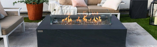 Modern black rectangular Elementi Plus Cape Town fire table with glass enclosure and glowing orange flames 16 kW