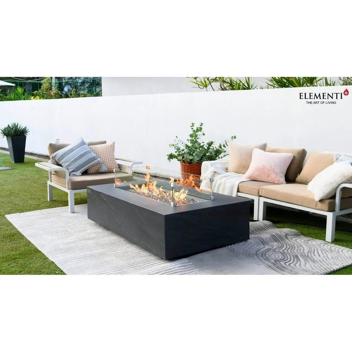 Black rectangular fire pit with glass top and burning flames Elementi Plus Cape Town Fire Table 16 kW OFG410SL