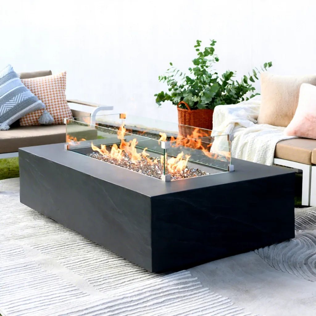 Black rectangular Elementi Plus Cape Town fire pit table with 16 kW glass enclosure and glowing flames
