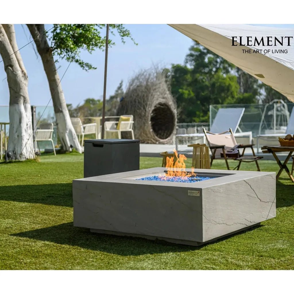 Gray concrete elementi plus capertee fire table with blue glass beads and orange flames producing 16 kW heat