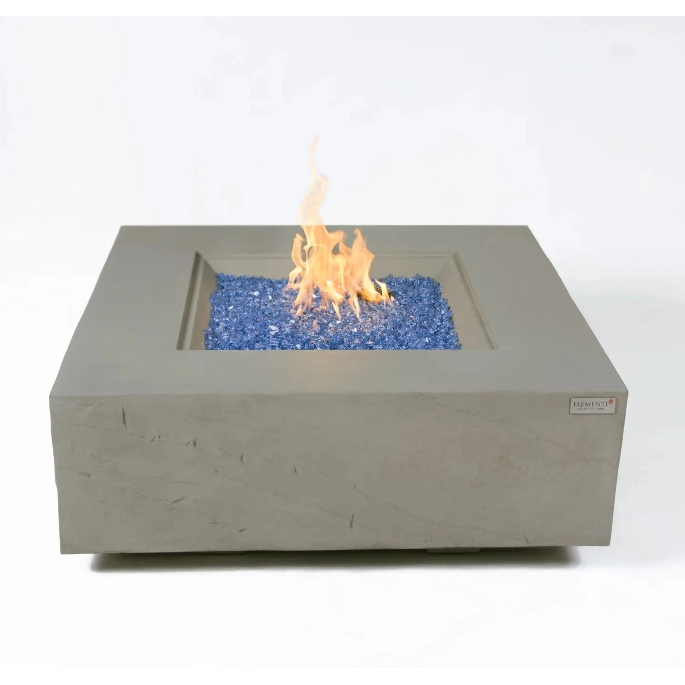 Gray concrete square fire pit Elementi Plus Capertee fire table with central flame over blue glass beads 16 kW
