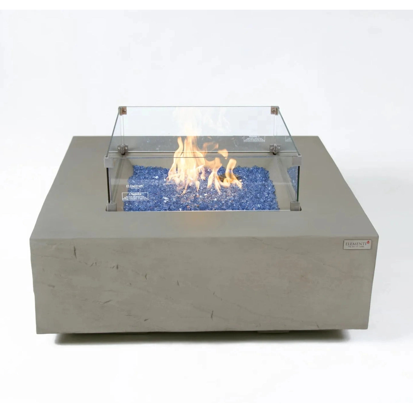Gray concrete square fire pit with clear glass enclosure and blue flame glass beads elementi plus caperte fire table