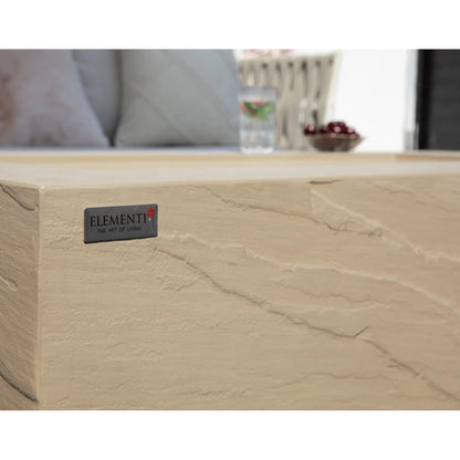 Beige stone coffee table with textured natural finish and elementi brand plaque for elementi plus colorado fire table 16 kw