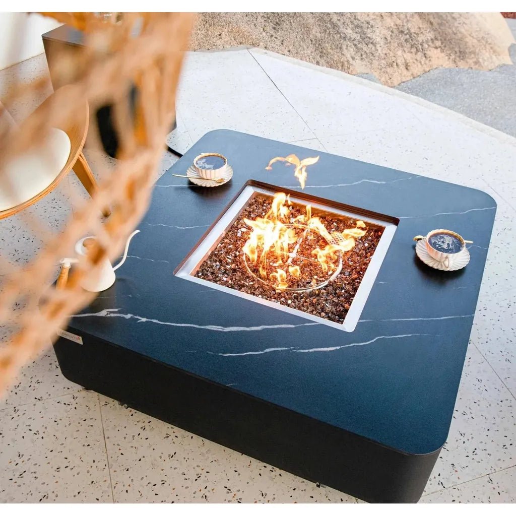 Elementi Plus Copenhagen porcelain top fire table with black marble surface and square glass-enclosed flame feature