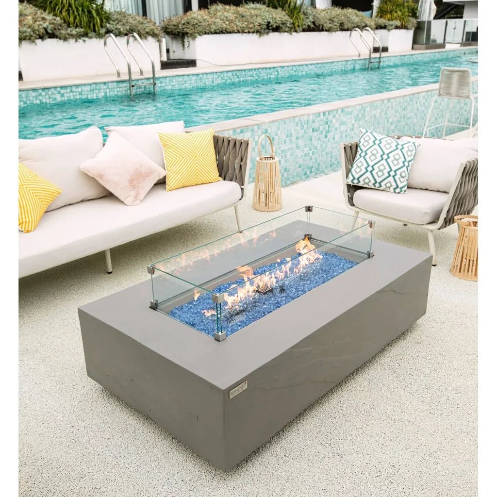 Elementi Plus Meteora fire table gray rectangular fire pit with glass enclosure and blue flameless stones 16 kW