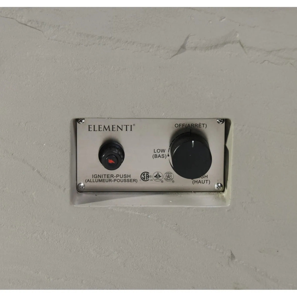 Silver rectangular control panel with black knobs for ignition and heat settings on elementi plus meteora fire table 16 kw