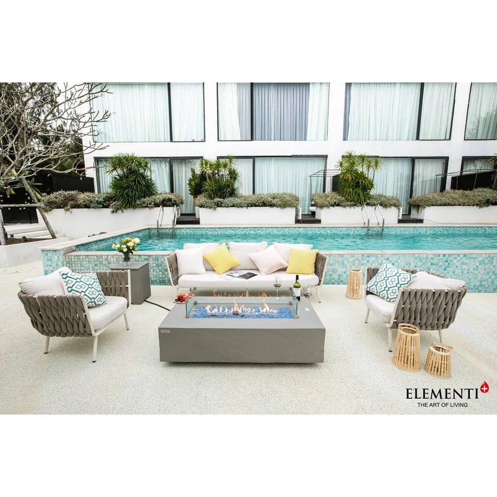 Gray rectangular glass top fire pit with blue flame elementi plus meteora fire table 16 kw ofg410sg