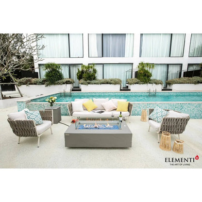 Gray rectangular glass top fire pit with blue flame elementi plus meteora fire table 16 kw ofg410sg