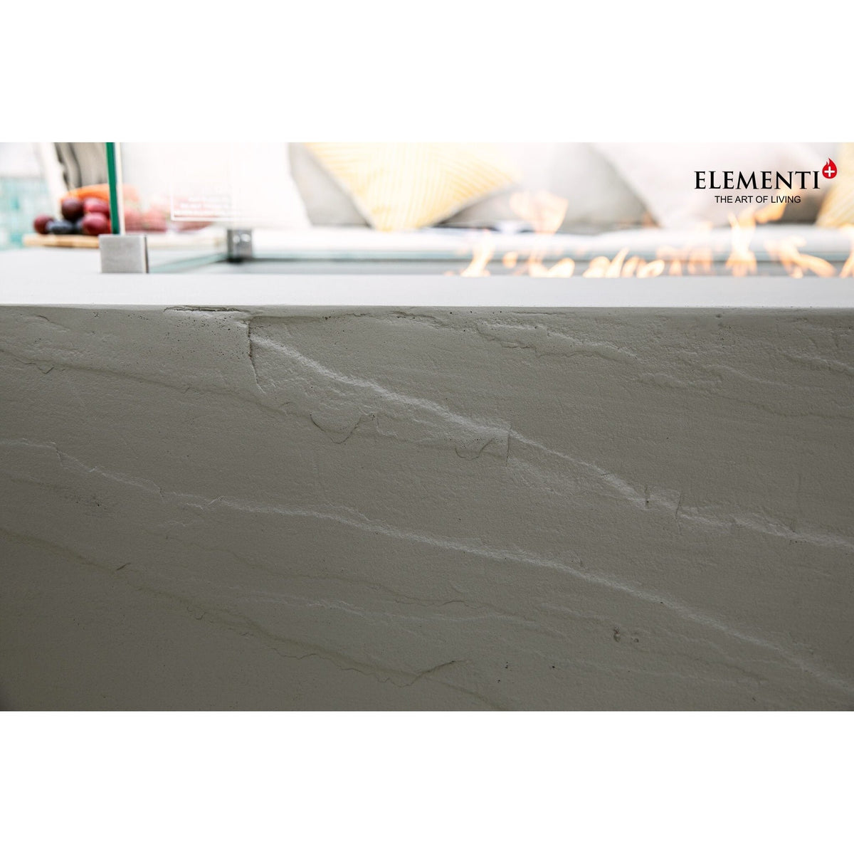 Elementi plus meteora fire table base in gray stone with subtle natural veining and 16 kW heat output