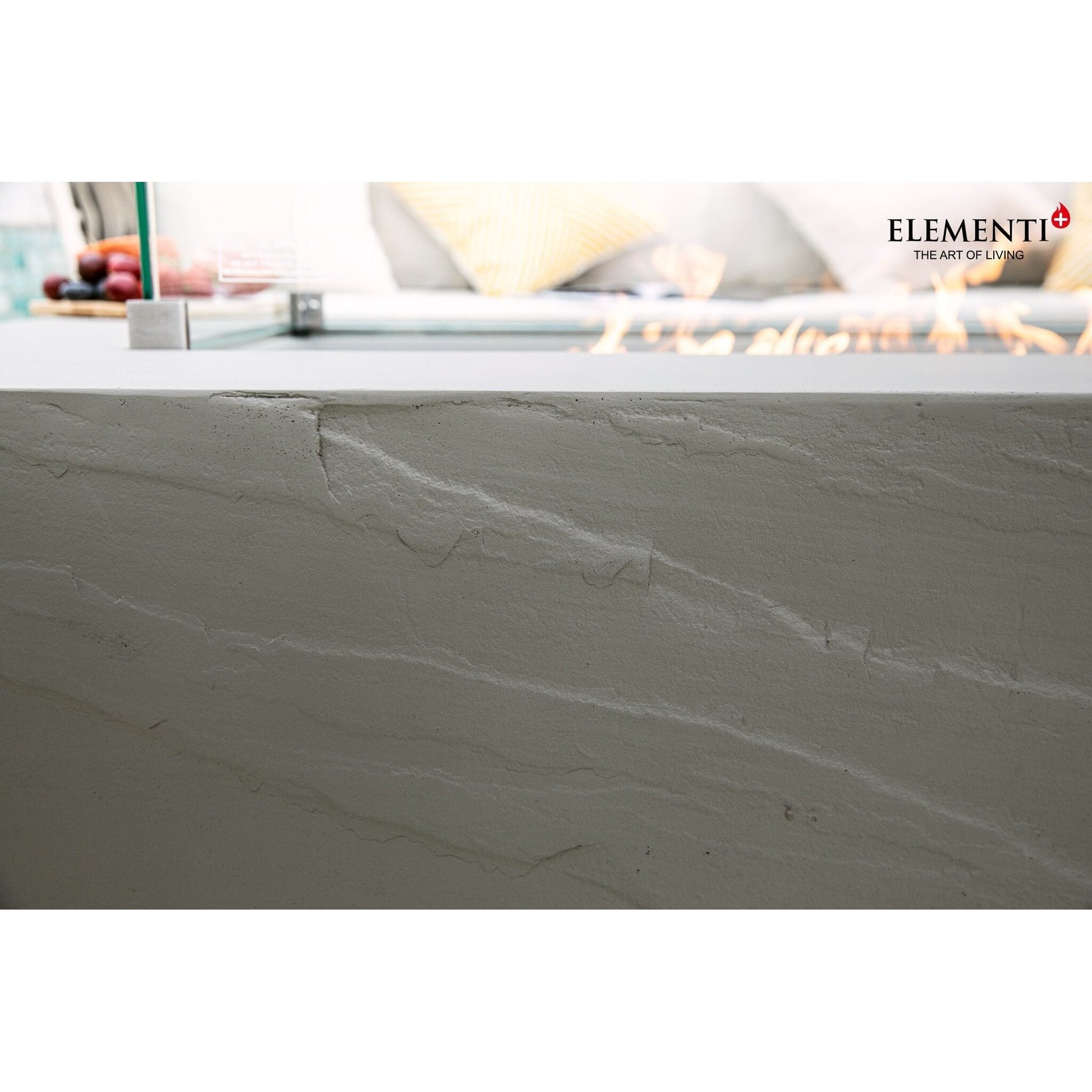 Elementi plus meteora fire table base in gray stone with subtle natural veining and 16 kW heat output