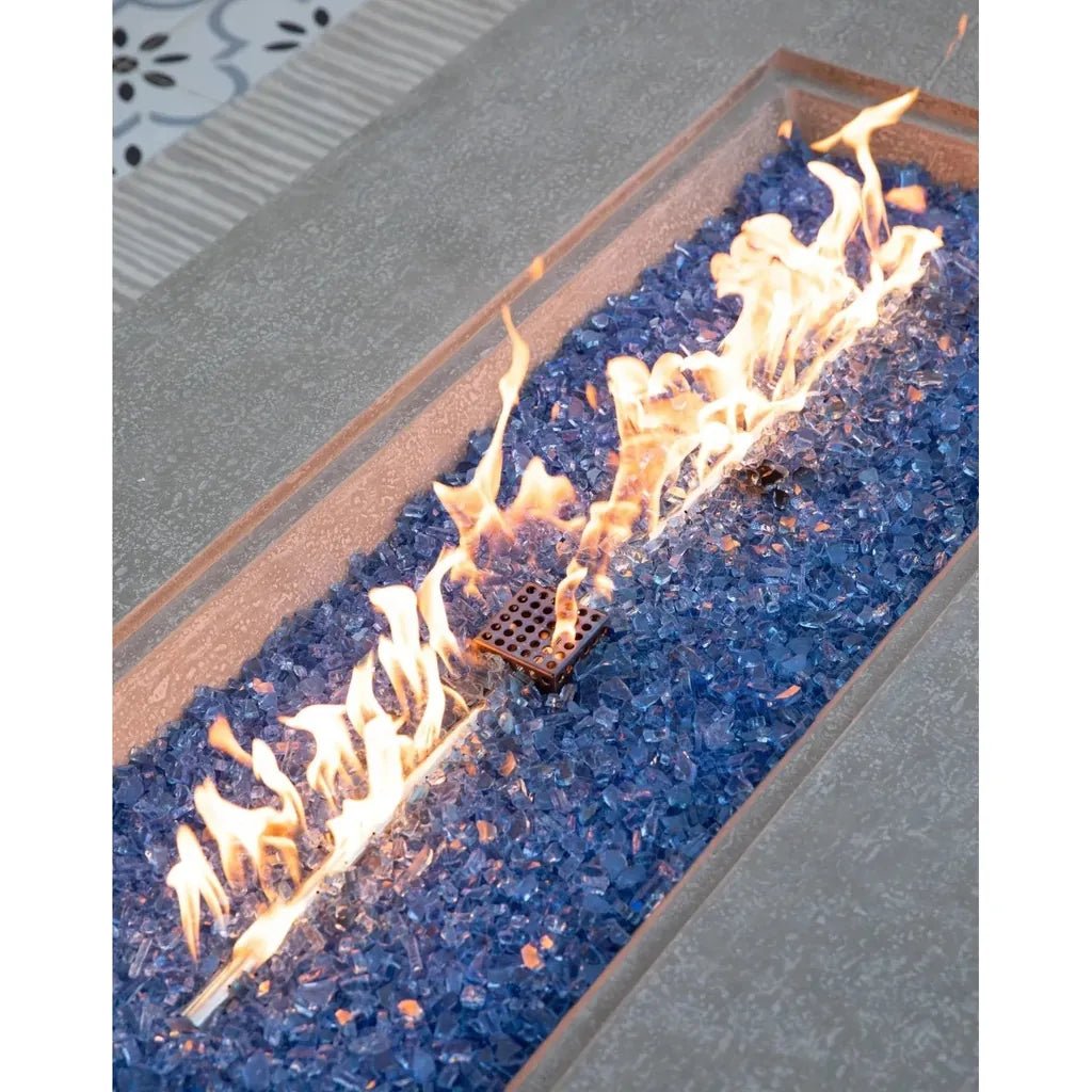 Elementi plus riviera fire table rectangular fire pit with blue glass beads and central burner emitting lively flames