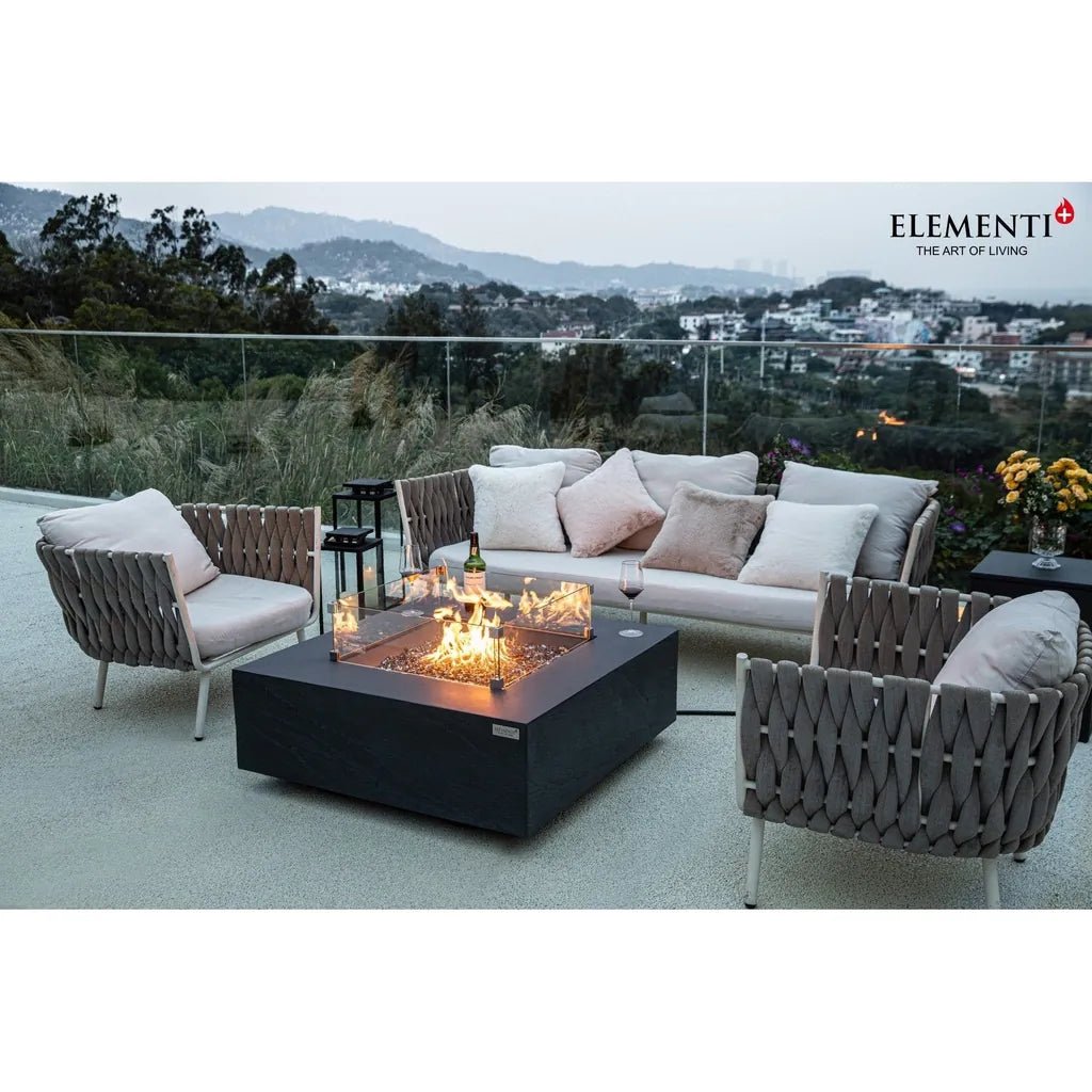 Gray woven wicker outdoor sofa set with light gray cushions and modern geometric design for elementi plus roraima fire table