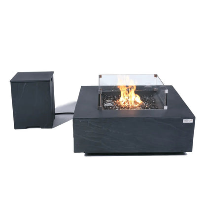 Elementi Plus Roraima fire table 16 kW modern black stone-effect fire pit with clear glass safety barrier and glowing flame
