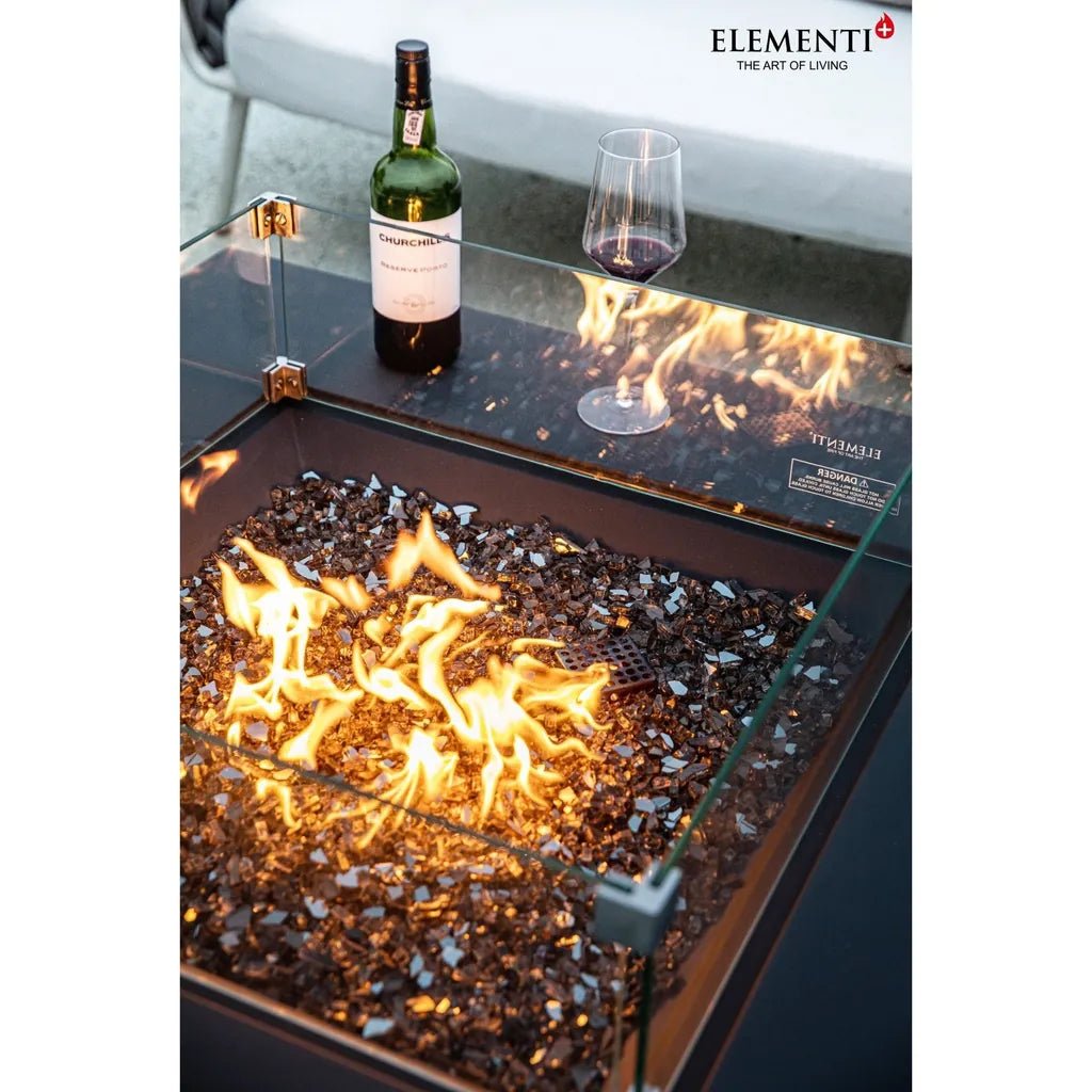 Elementi plus Roraima fire table with glass top black and gold frame dark glass beads and glowing orange flames