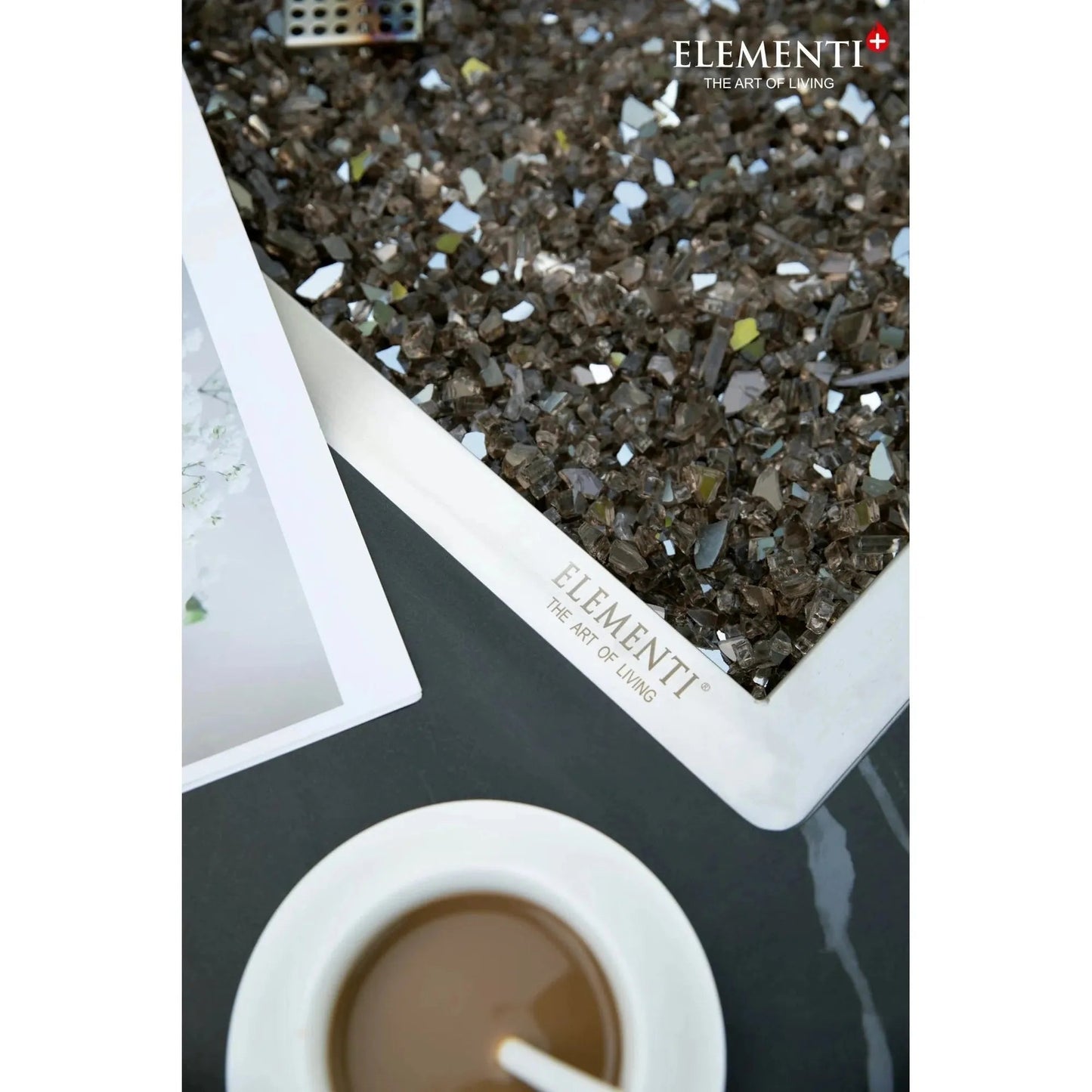 White rectangular tray of dark brown and silver reflective glass shards for Elementi plus Sofia fire table 16 kW OFP103BB