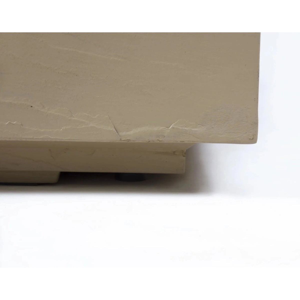 Beige plastic tile with textured cracked surface and visible base molding for elementi plus uluru fire table 16 kw