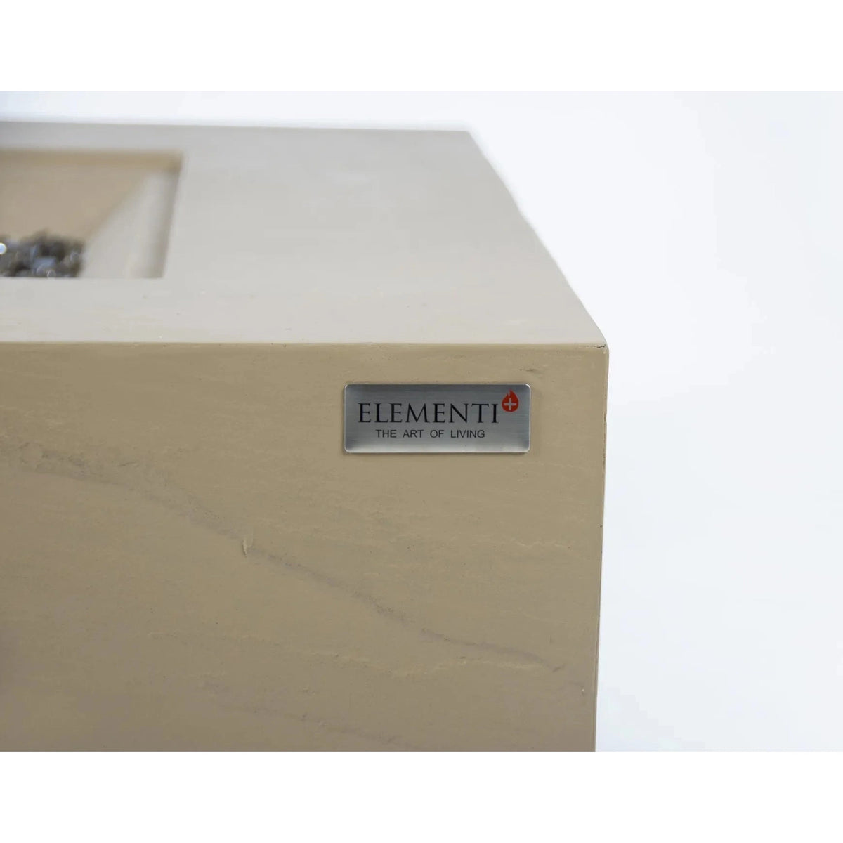 Beige marble elementi plus uluru fire table fireplace with sleek silver plaque featuring elementi brand name