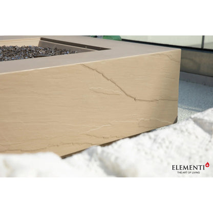 Elementi Plus Uluru fire table with 16 kW heat output featuring a beige stone fire pit with crackled texture and gray glass beads