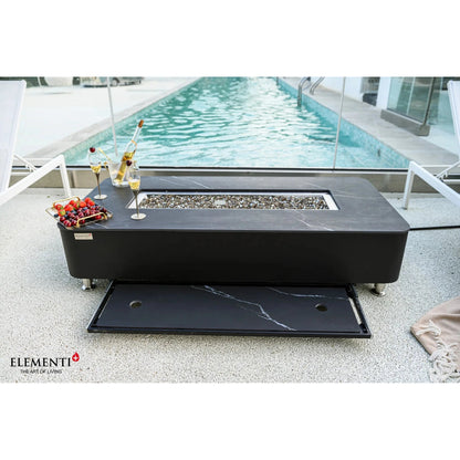 Elementi plus valencia fire table with black marble top, sleek modern design, and silver legs for outdoor heating