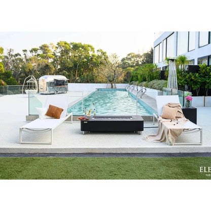 Black rectangular Elementi Plus Valencia fire table with sleek modern design metallic legs and 16 kW output