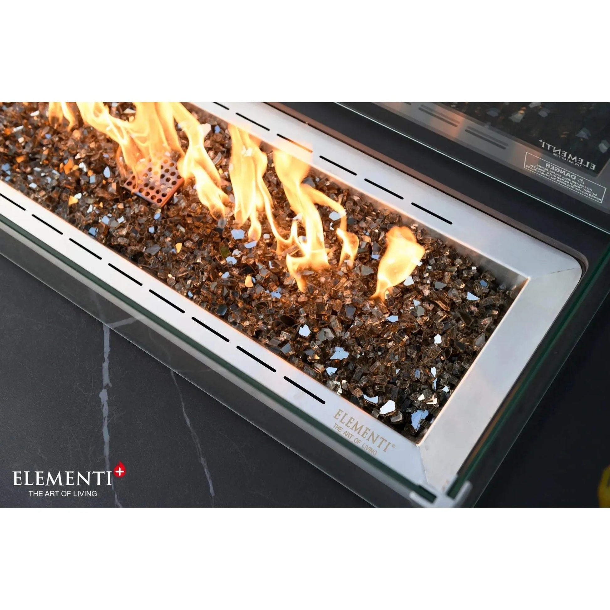 Elementi Plus Valencia fire table outdoor gas fireplace with silver frame black glass mosaic fireglass and orange flames