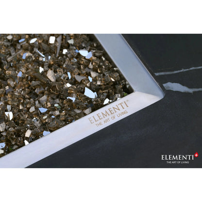 Elementi Plus Varna fire table 16 kW with sleek silver frame and amber glass shards for modern outdoor heating