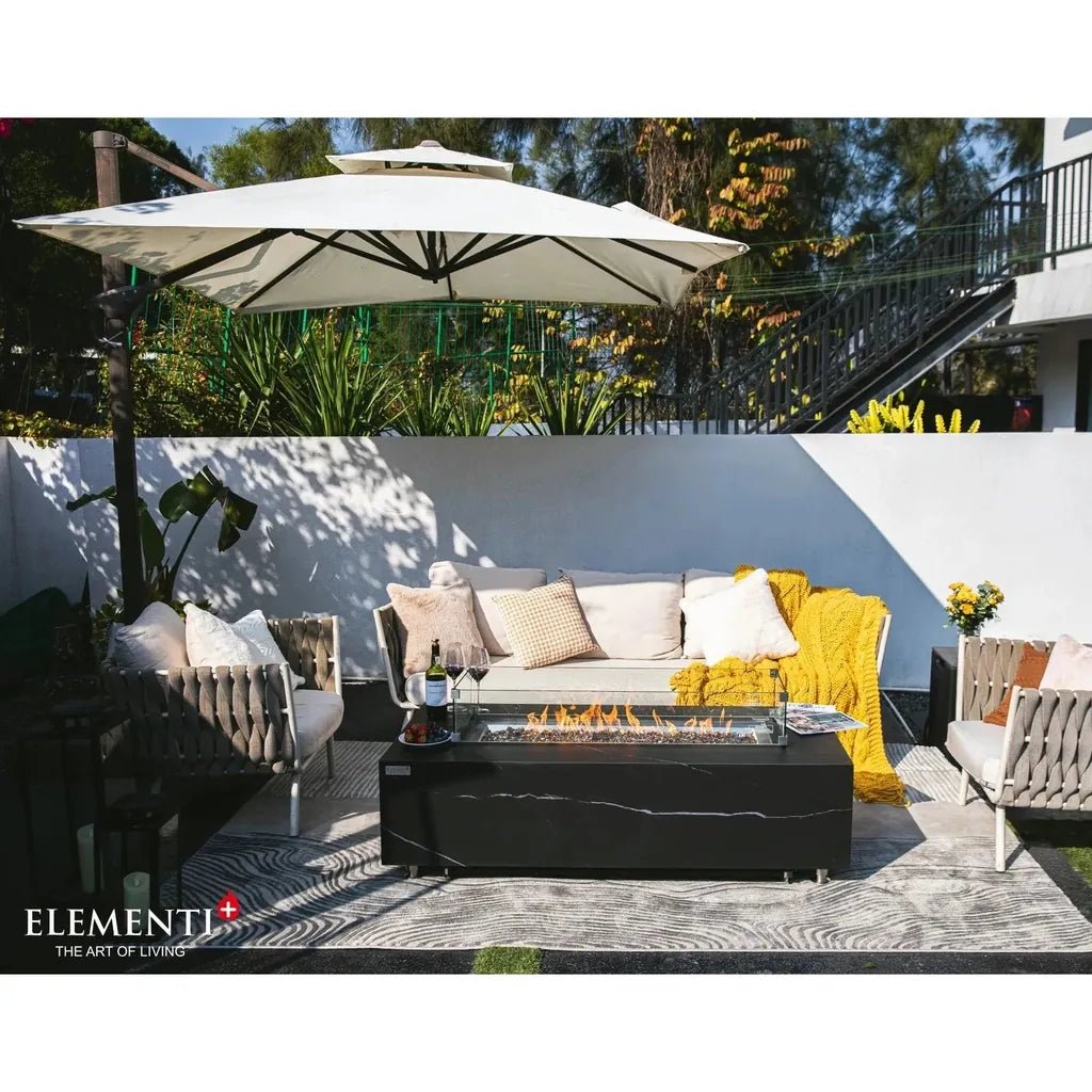 Black marble-effect elementi plus varna fire table with glass insert and 16 kW flames for outdoor use
