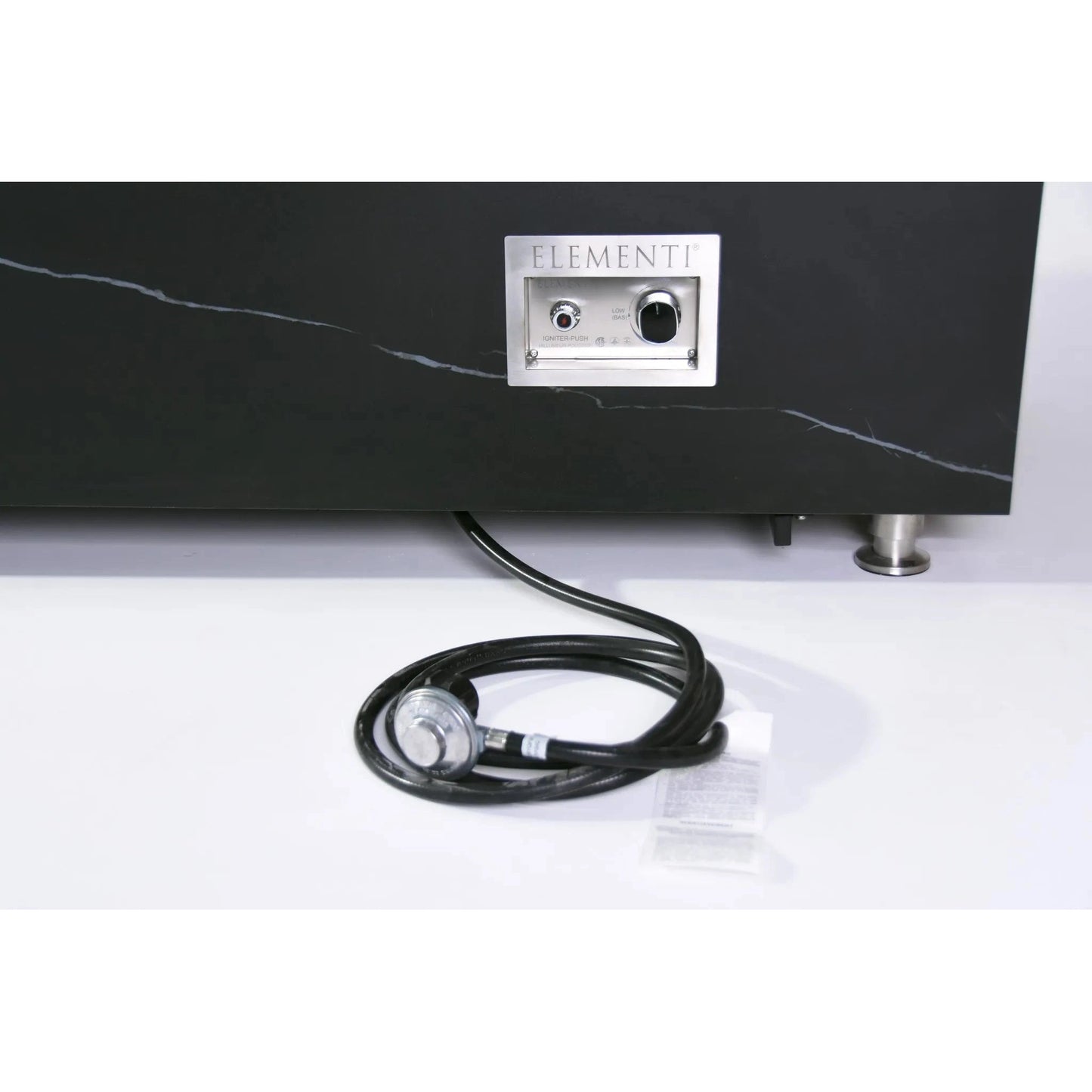 Black marble elementi plus varna fire table with silver control panel and coiled black cable showing appliance back side