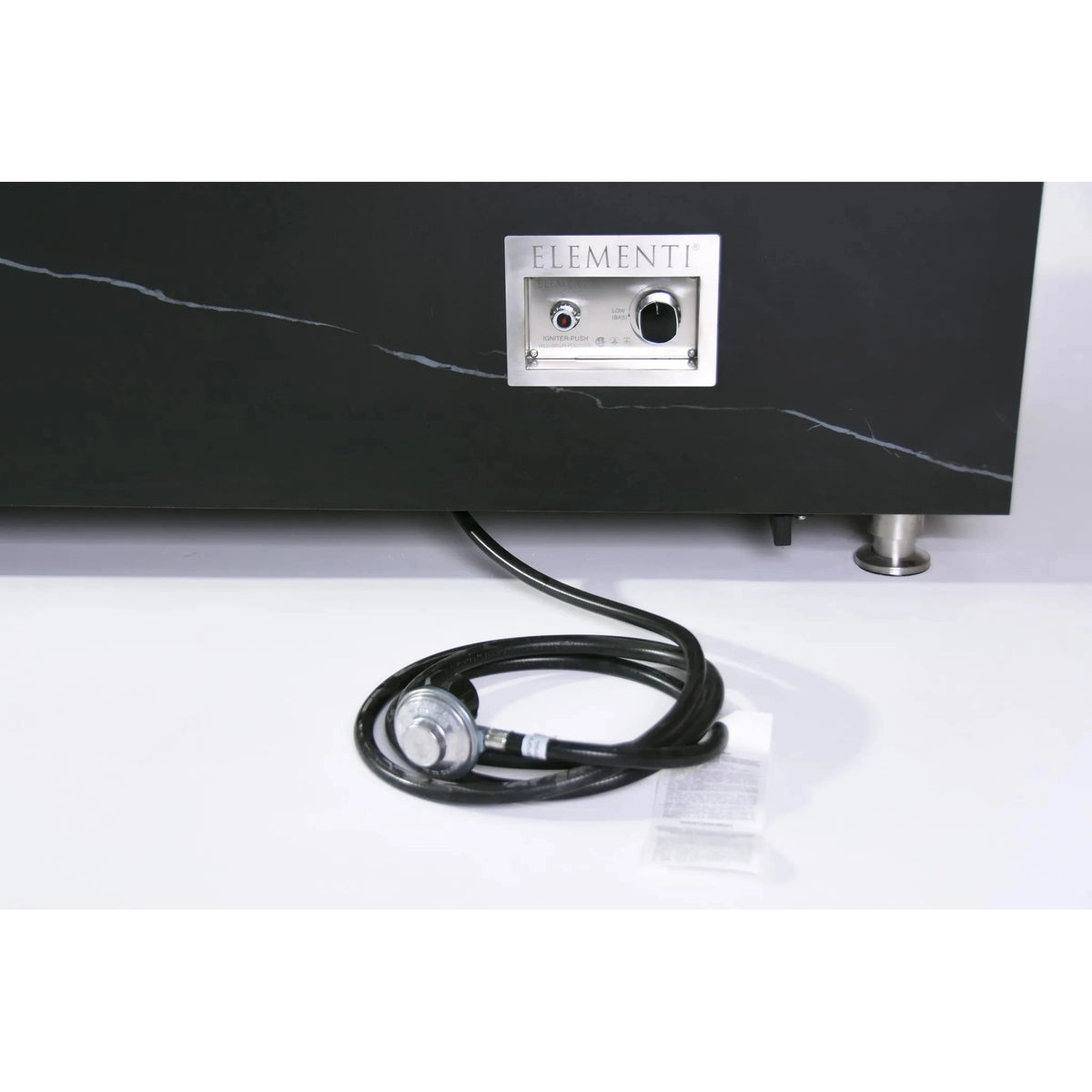 Black marble elementi plus varna fire table with silver control panel and coiled black cable showing appliance back side