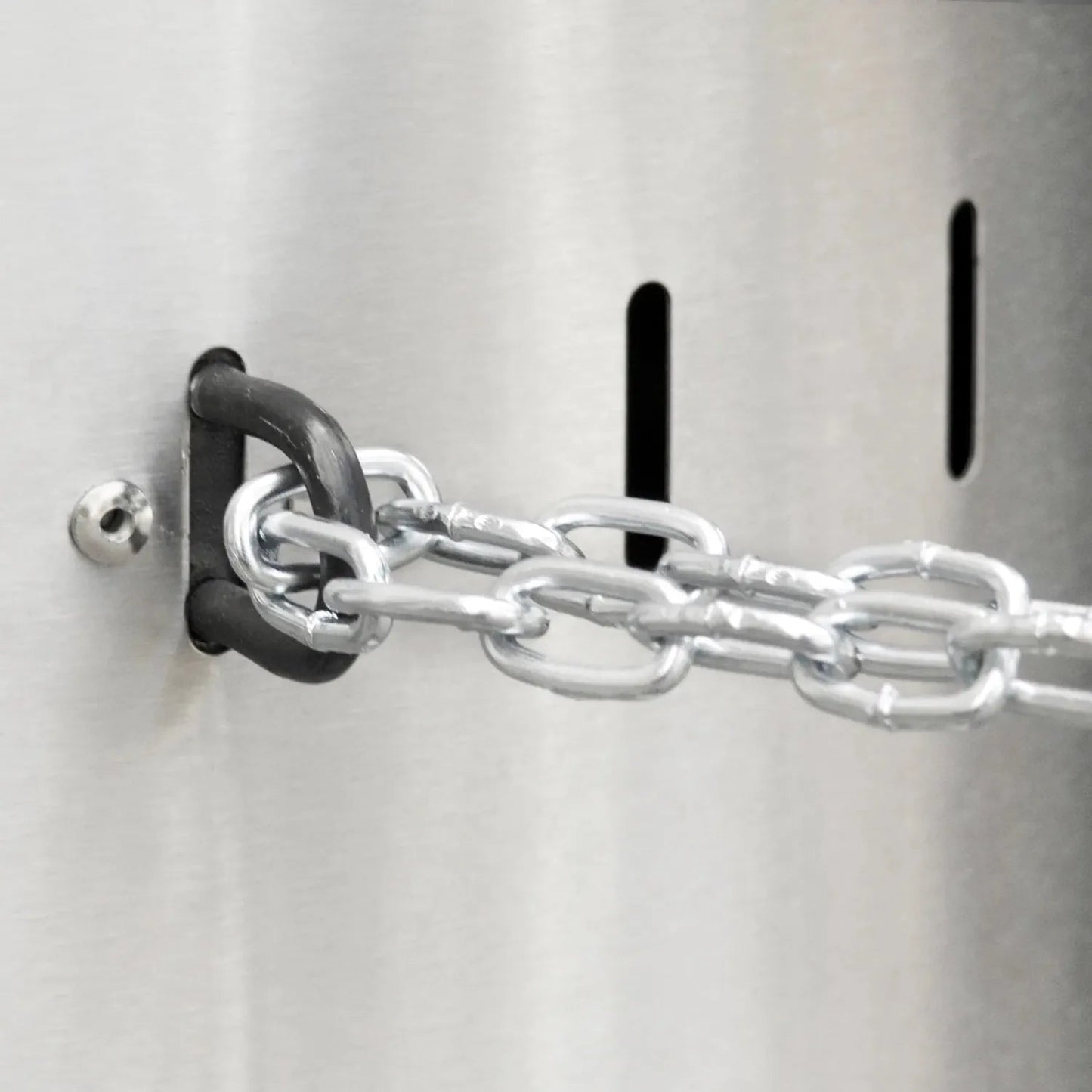 Silver metal chain with black rubber-coated d-ring attached to metallic surface on enders commercial patio heater lfs840