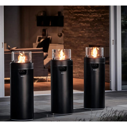 Three sleek black cylindrical enders large nova led flame fire pits with glass tops and glowing flames for patios