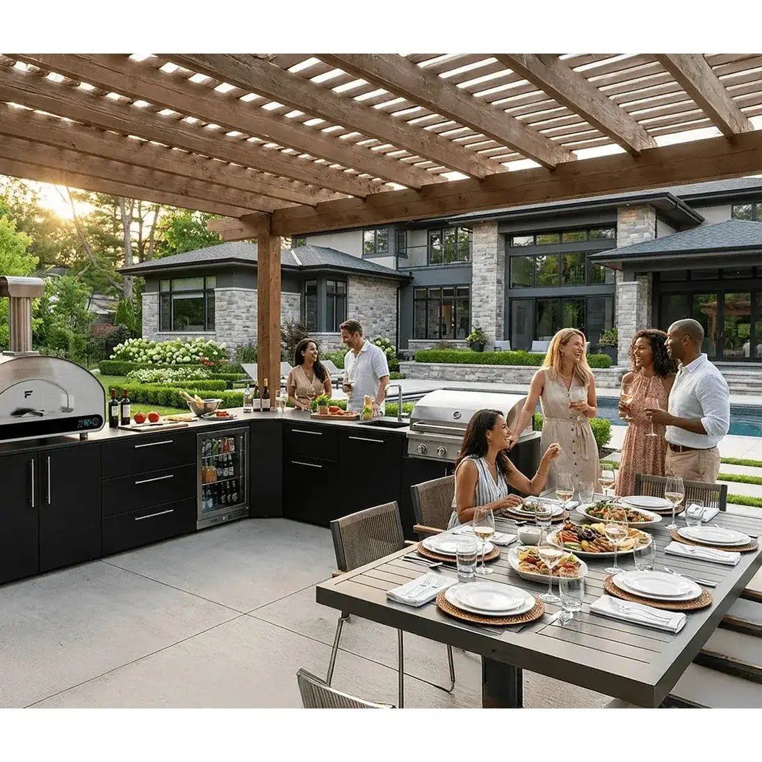 Black outdoor kitchen with wooden pergola and stainless steel appliances featuring fontana forni volta 90 dual fuel pizza oven